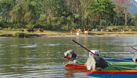 Panoramic view of Vang Vieng’s scenic landscape for a scenic Vang Vieng Tours banner by Legend Travel Group.
